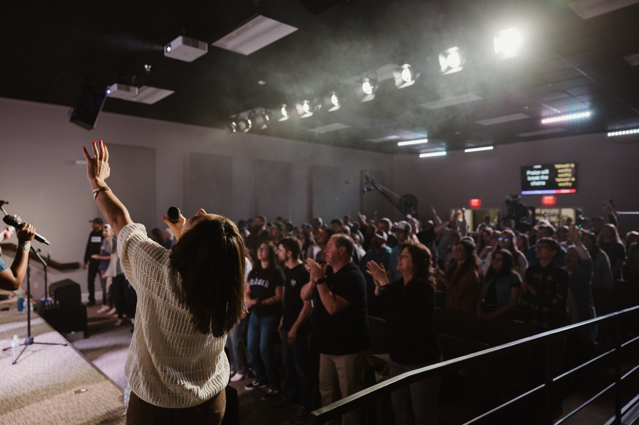 Worship leader and crowd at Amplify